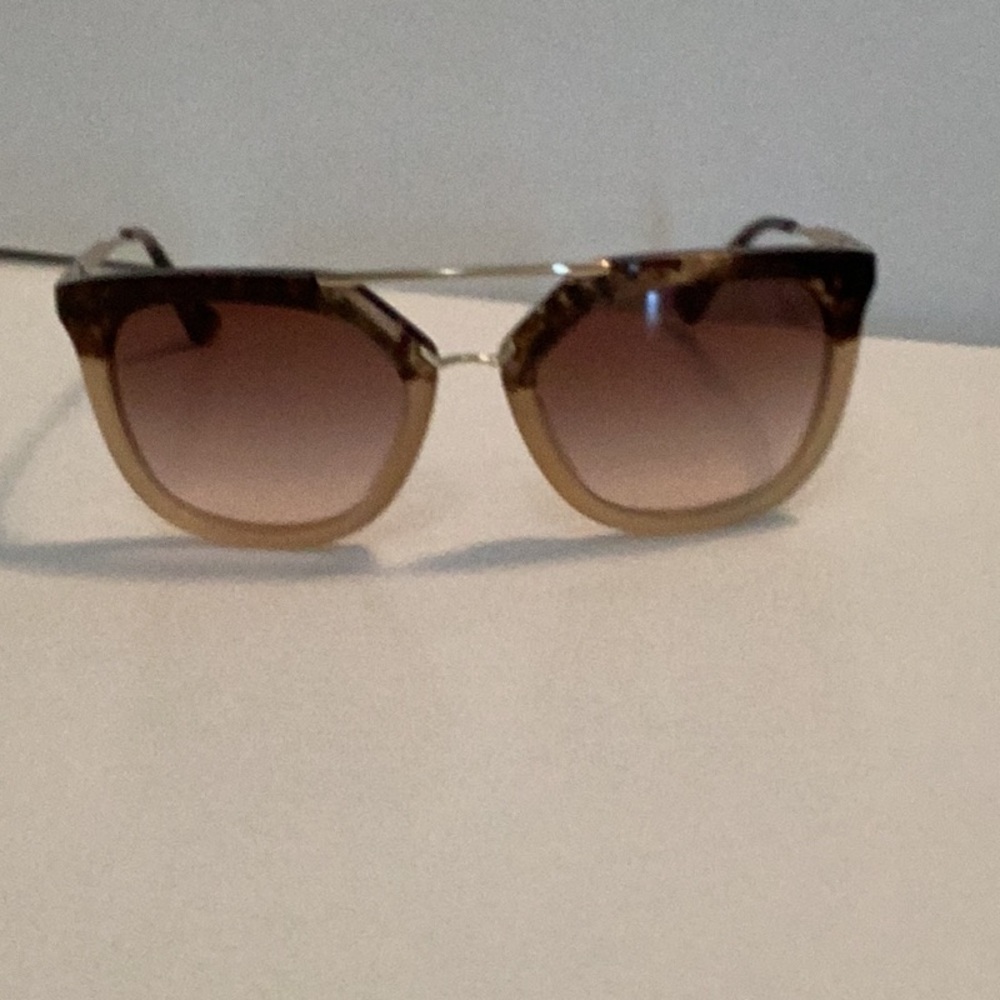 Prada Tortoise and light brown sunglasses